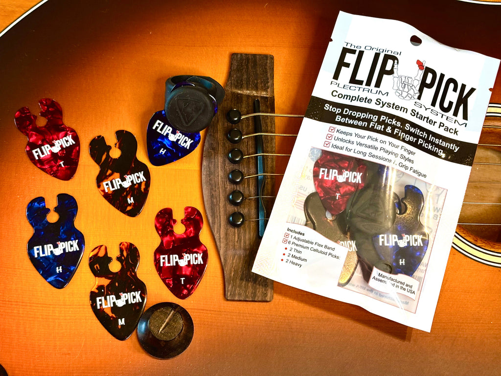 A package of Music City Made Flip-Pick guitar string winder beads and six colorful plastic guitar picks arranged on a wooden guitar headstock.